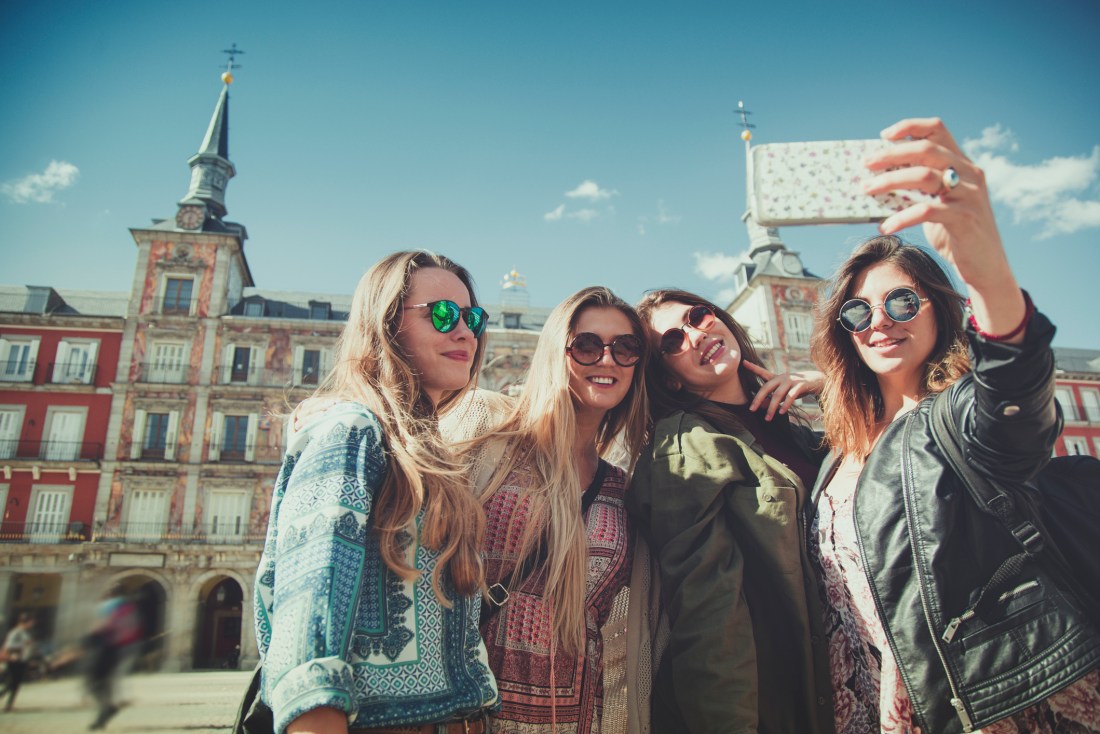 Tourist woman selfie in Plaza Major, Madrid